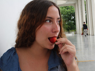 Cute eating strawberries