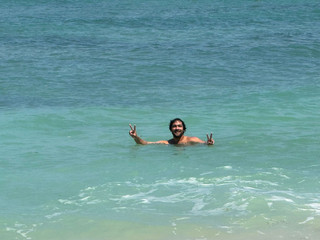 handsome man swimming in the sea